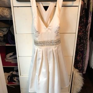 Cream/off white silk short dress with open back.